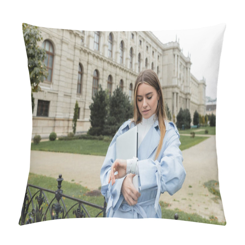 Personality  Pretty Woman In Blue Trench Coat Holding Laptop And Checking Time On Wristwatch Near Historical Building In Vienna  Pillow Covers