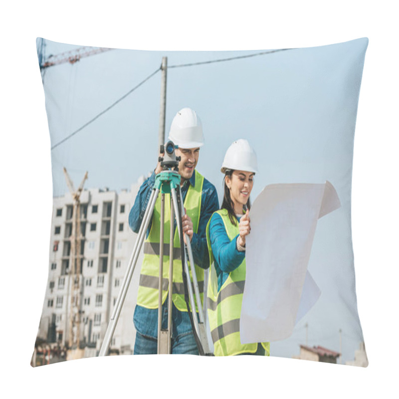 Personality  Smiling Surveyors With Digital Level Looking At Blueprint On Construction Site Pillow Covers