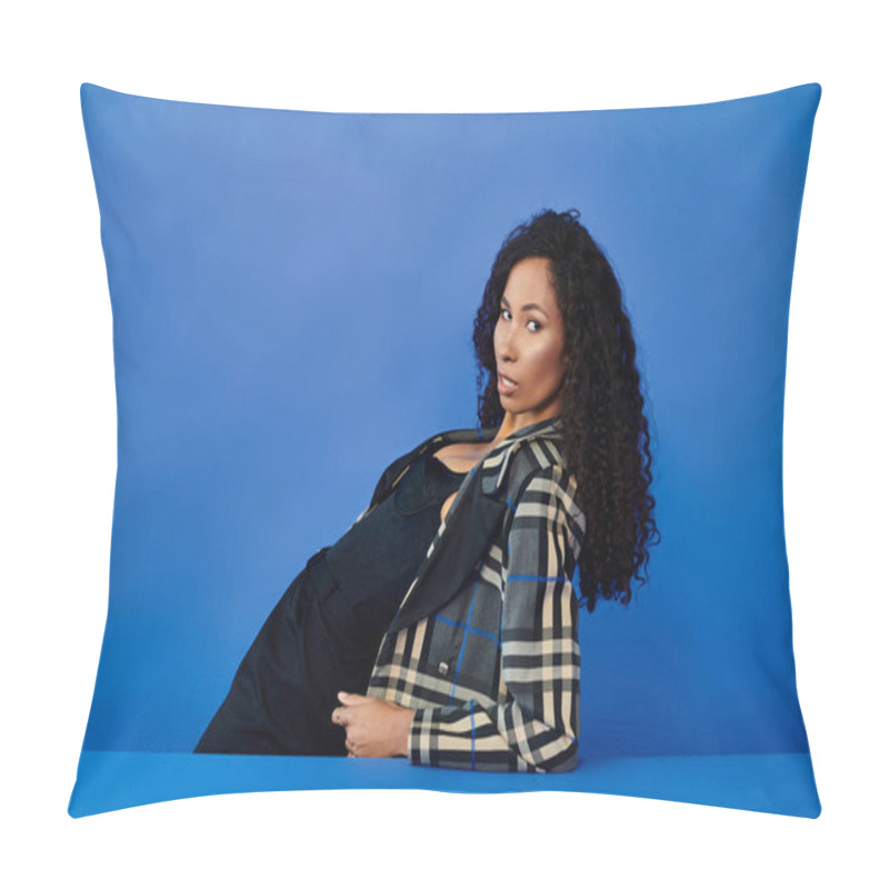 Personality  A Stunning Woman Showcases Her Fashion Sense With A Playful Posture Against Vibrant Blue Tones. Pillow Covers