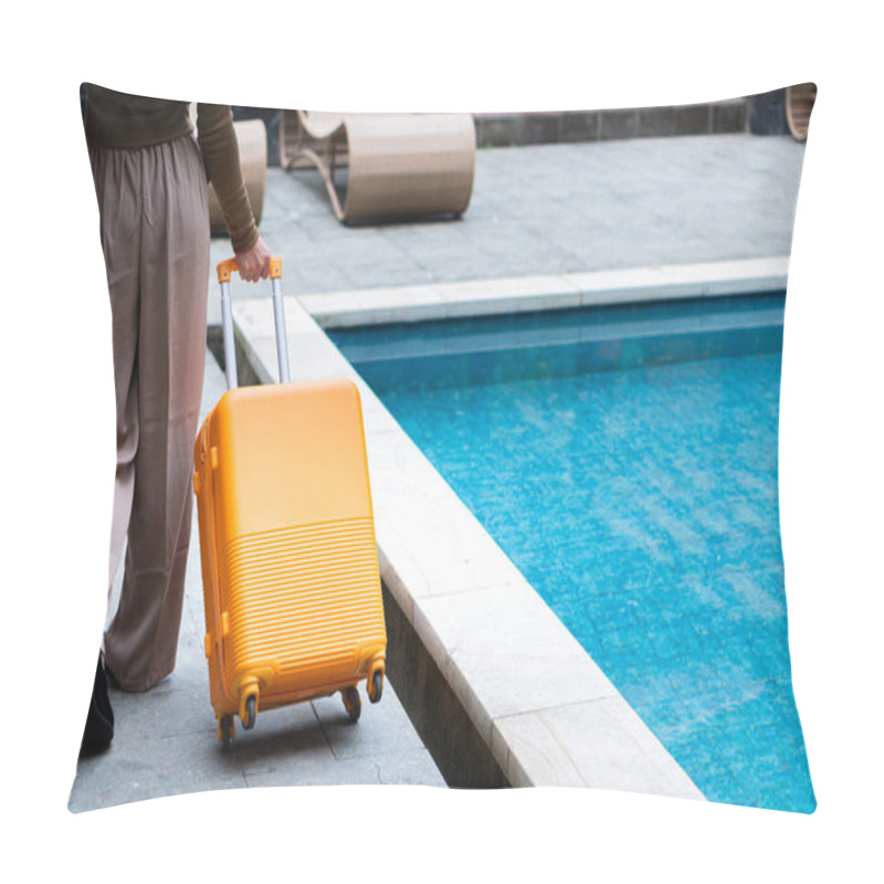 Personality  A Woman Walking By A Poolside With An Orange Suitcase, Wearing A Hat And Stylish Outfit. The Background Features Lush Greenery And A Wooden Structure, Creating A Tropical Vacation Vibe. Pillow Covers