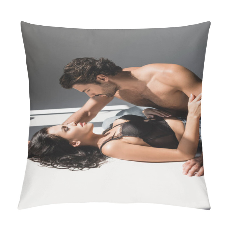 Personality  Muscular Man Looking At Sexy Girlfriend Lying On Grey Background With Shadow  Pillow Covers