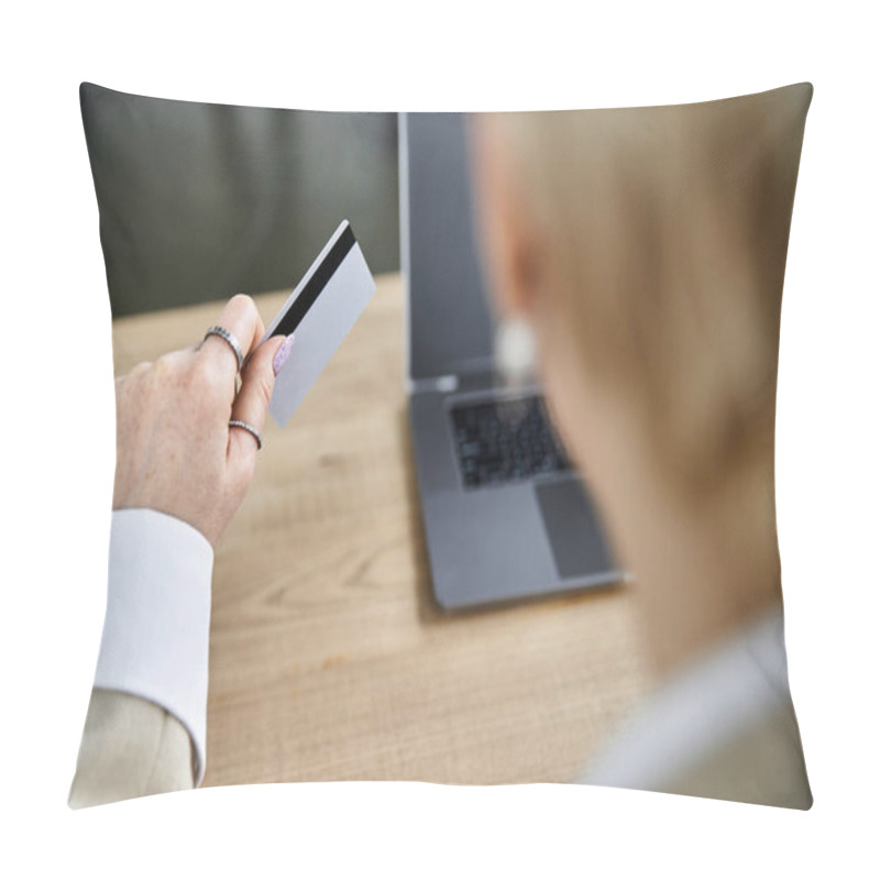 Personality  An Adult Woman Dressed In Stylish Attire Thoughtfully Holds A Card While Ready To Shop Online. Pillow Covers