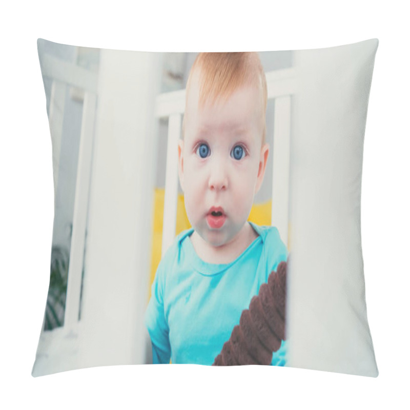 Personality  Infant Boy Sitting In Blurred Baby Crib With Soft Toy Pillow Covers