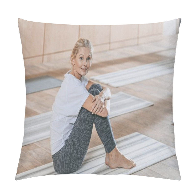 Personality  Beautiful Mature Woman Sitting On Yoga Mat And Smiling At Camera At Training Class Pillow Covers