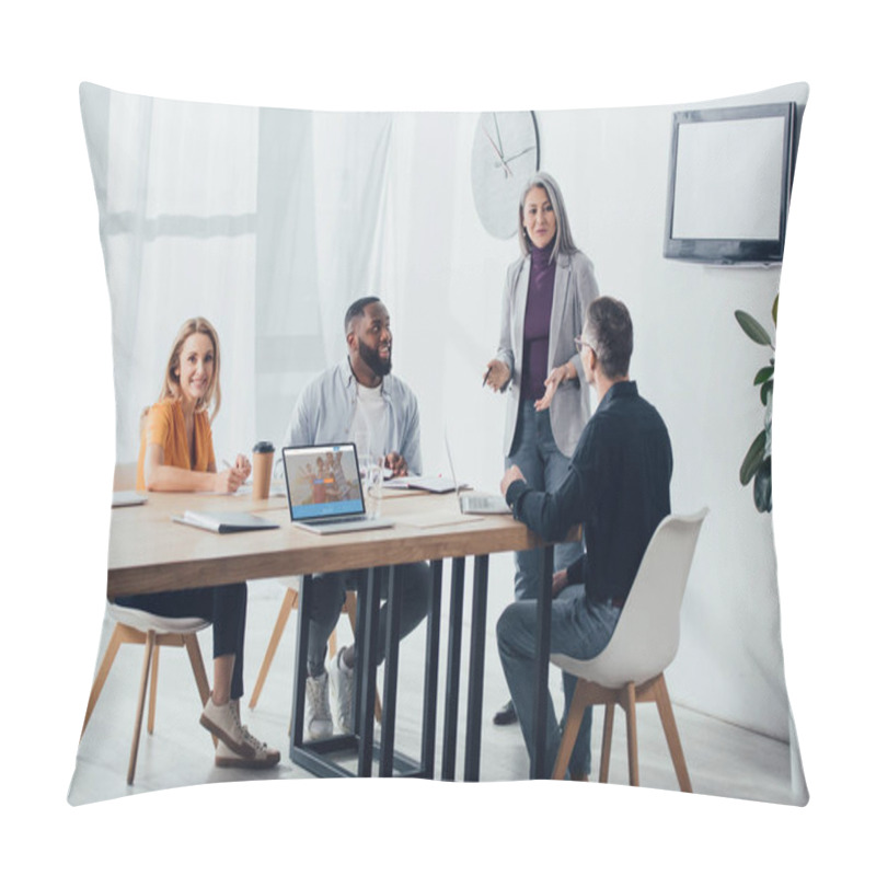 Personality  KYIV, UKRAINE - DECEMBER 6, 2019: Smiling Multicultural Colleagues Talking With Asian Businesswoman Near Laptop With Couchsurfing Website  Pillow Covers