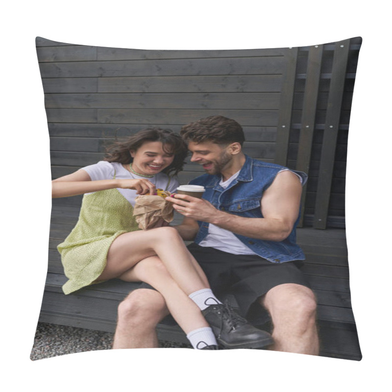 Personality  Positive Brunette Woman In Boots And Sundress Holding Fresh Bun Near Stylish Boyfriend In Denim Vest With Coffee To Go While Sitting Near Wooden House At Background, Serene Ambiance Concept Pillow Covers