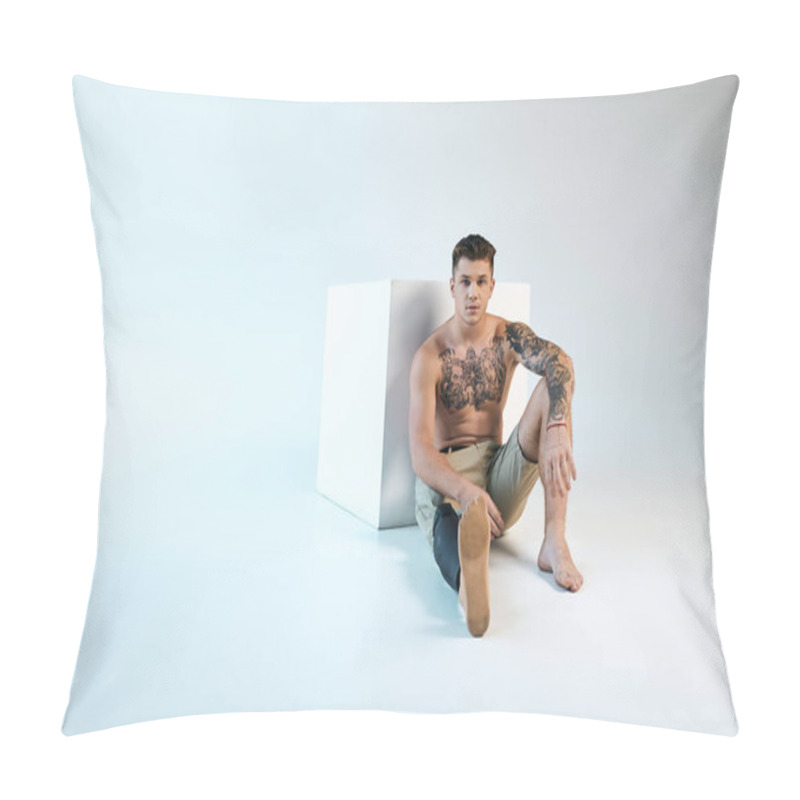 Personality  A Tattooed Young Man Seated Elegantly On The Floor In A Vibrant Studio, Showcasing His Prosthetic Leg. Pillow Covers