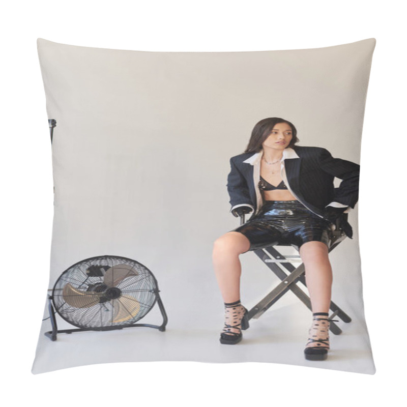 Personality  Studio Photography, Young Asian Woman In Blazer, White Shirt And Latex Shorts Sitting On Folding Chair Near Electric Fan On Grey Background, Fashion And Style, Looking Away, Full Length  Pillow Covers