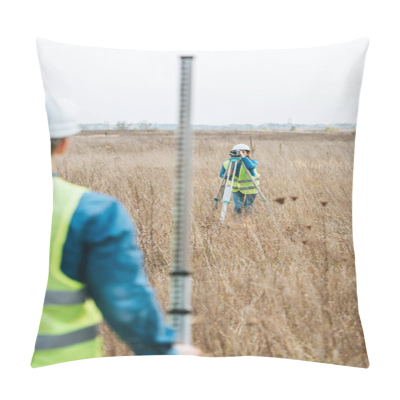 Personality  Selective Focus Of Surveyors With Digital Level And Ruler Working In Field Pillow Covers