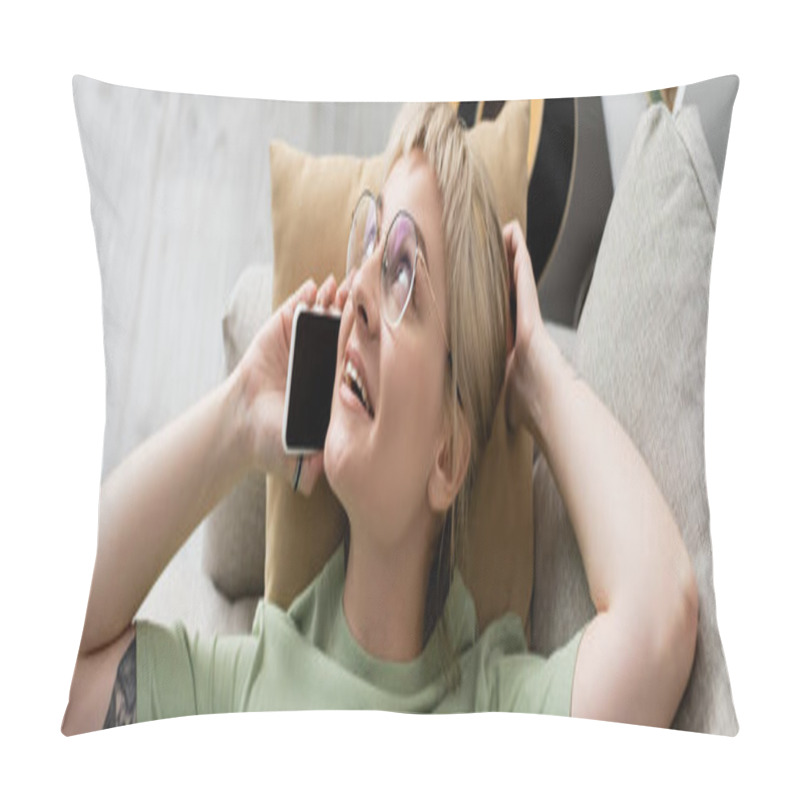 Personality  Overhead View Of Happy Young Woman With Blonde And Short Hair, Bangs And Eyeglasses Talking On Smartphone While Resting On Comfortable Couch Near Guitar In Modern Living Room, Banner  Pillow Covers