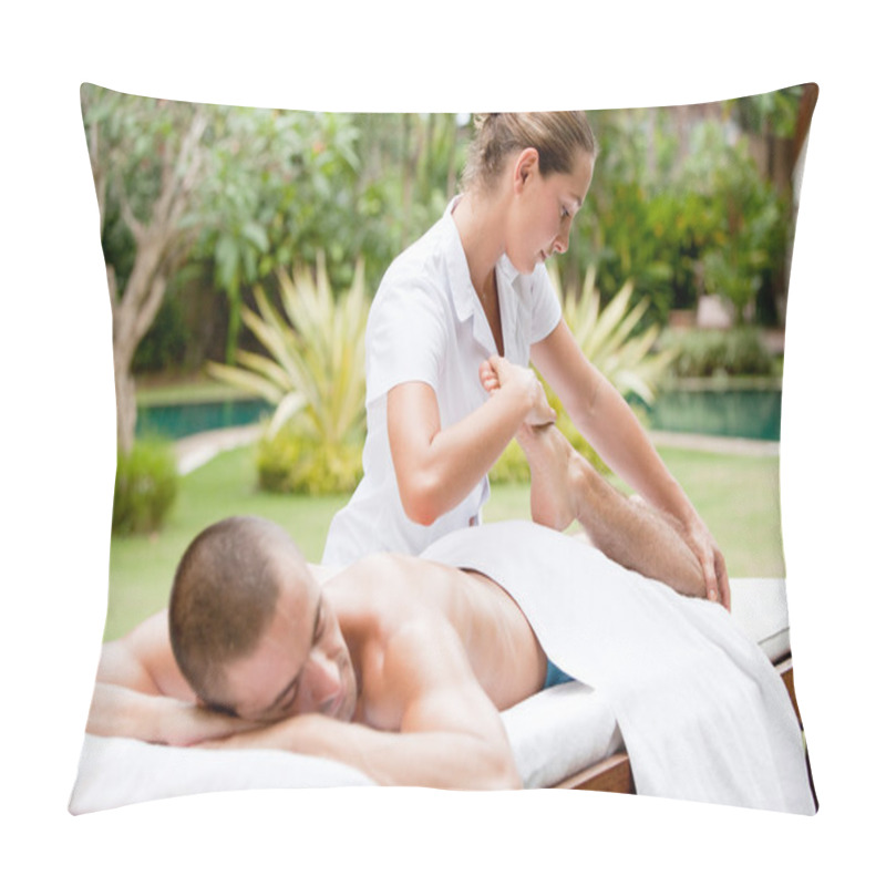 Personality  Young Masseuse Massaging And Stretching The Body Of An Attractive Man In A Tropical Hotel Garden Near A Swimming Pool. Pillow Covers