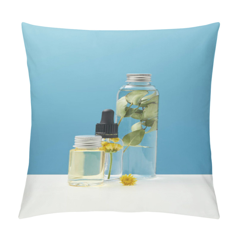 Personality  Organic Cosmetic Products With Green Leaves And Flowers In Transparent Bottles Isolated On Blue  Pillow Covers