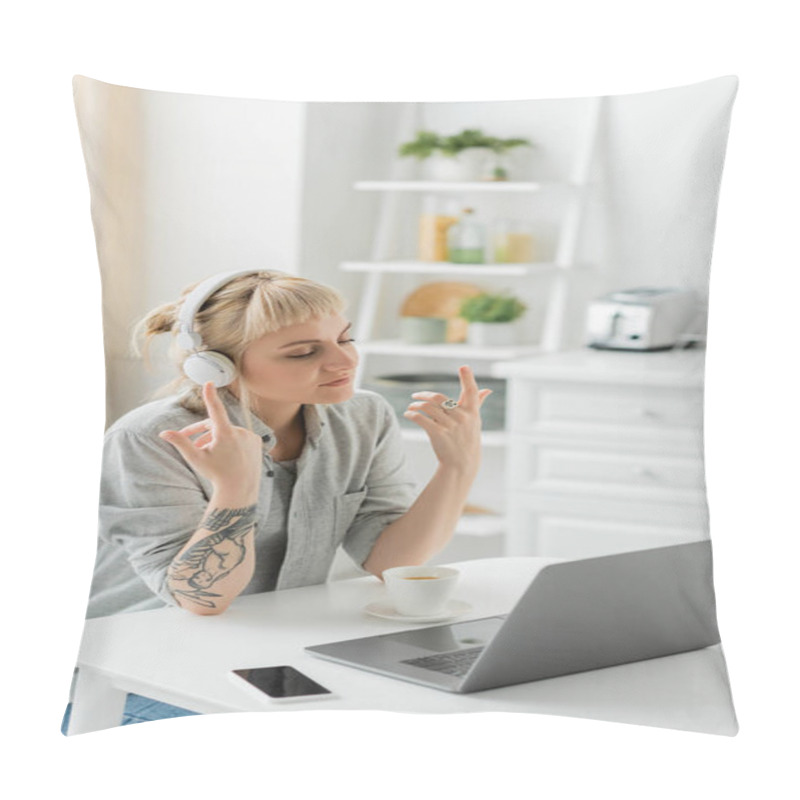 Personality  Young Woman With Bangs And Tattoo On Hand Sitting In Wireless Headphones And Gesturing Near Laptop, Cup Of Coffee And Blurred Smartphone With Blank Screen On Table, Freelance, Work From Home Pillow Covers