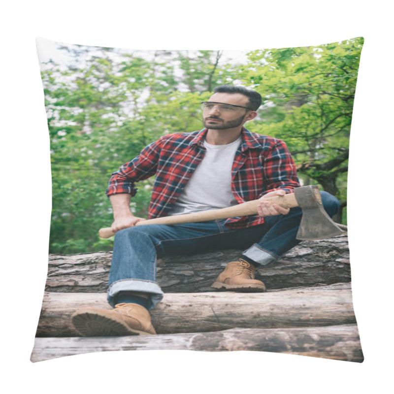 Personality  Thoughtful Lumberman Holding Ax While Sitting On Tree Trunks In Forest And Looking Away Pillow Covers