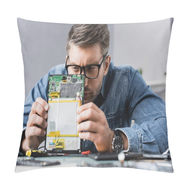 Personality  Focused Repairman Squinting, While Looking At Part Of Broken Digital Tablet With Blurred Workplace On Foreground Pillow Covers