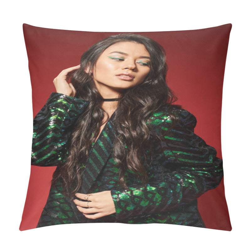 Personality  Asian Brunette Woman In Trendy Green Jacket With Sequins Adjusting Wavy Hair On Red Background Pillow Covers