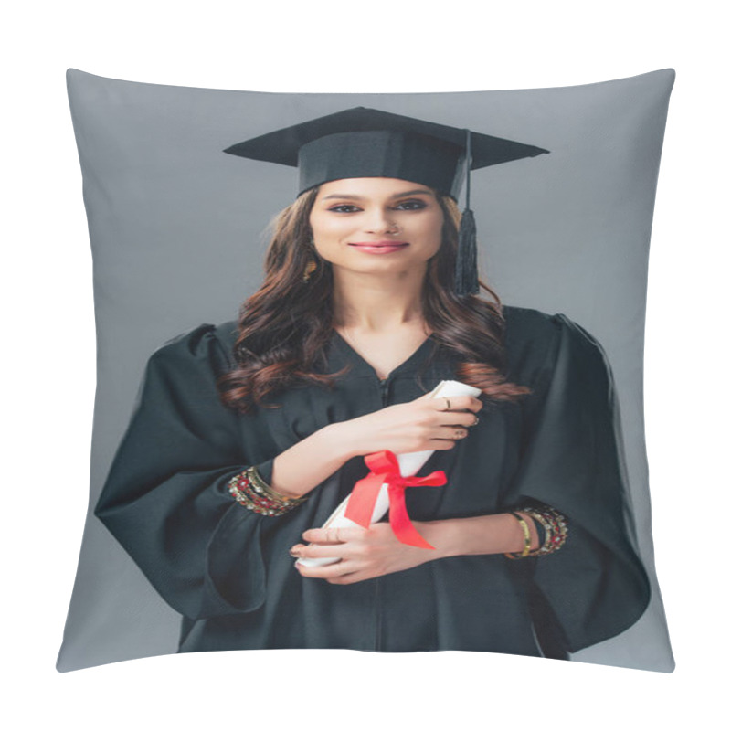 Personality  Happy Female Indian Student In Academic Gown And Graduation Hat Holding Diploma, Isolated On Grey Pillow Covers