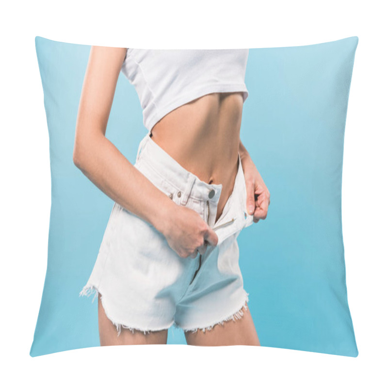 Personality  Cropped View Of Slim Girl In Crop Top Taking Off Shorts On Blue Background Pillow Covers