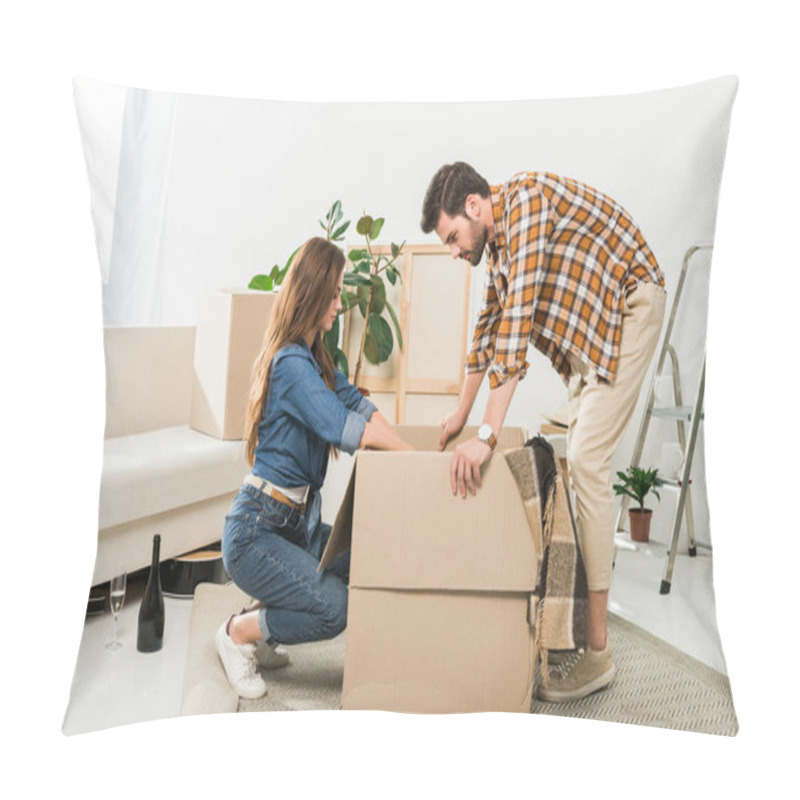 Personality  Side View Of Couple Unpacking Cardboard Boxes Together At New Home, Moving Home Concept Pillow Covers