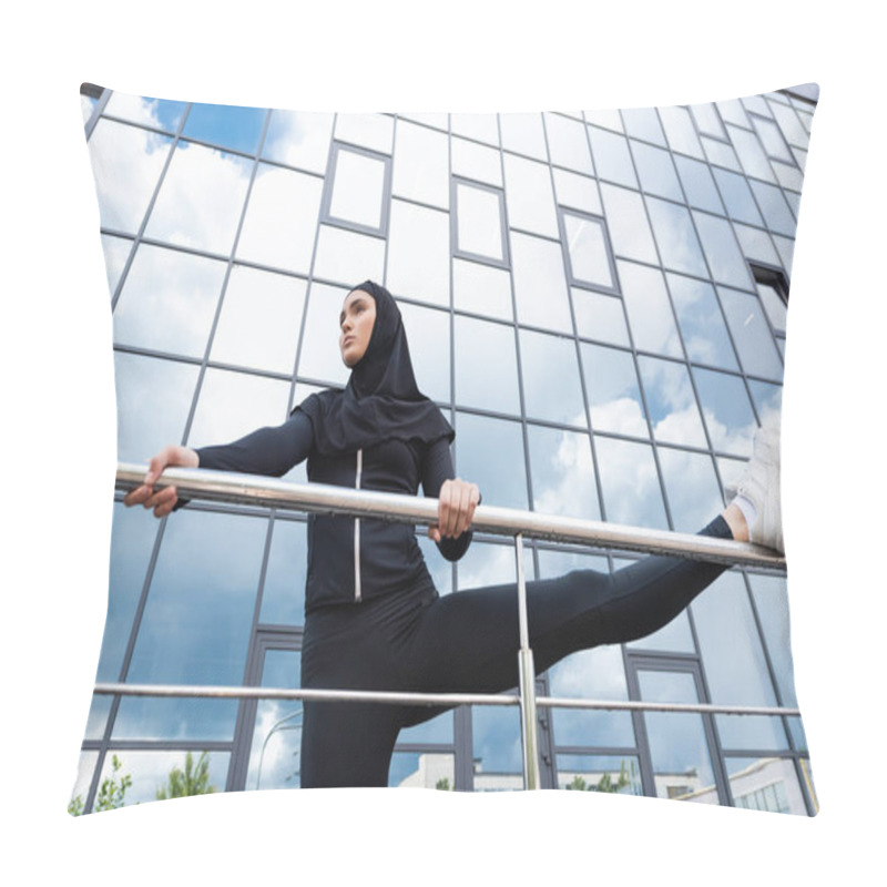 Personality  Low Angle View Of Arabian Woman In Hijab Holding Handrail While Exercising Near Modern Building  Pillow Covers