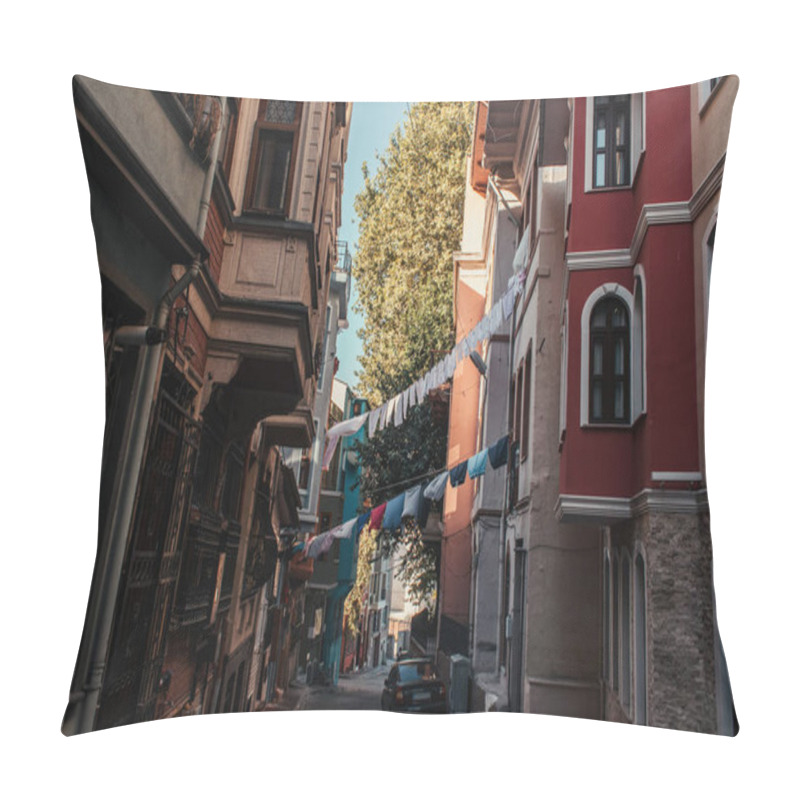 Personality  ISTANBUL, TURKEY - NOVEMBER 12, 2020: Car And Clothesline With Laundry Between Houses On Narrow Street In Balat Pillow Covers