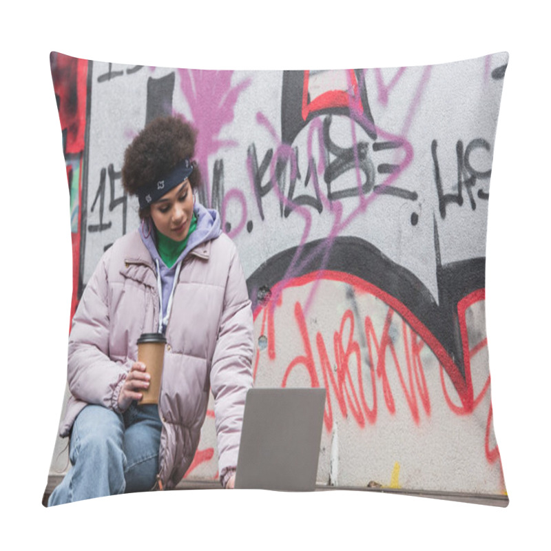 Personality  African American Woman Holding Coffee To Go And Using Laptop Near Graffiti Outdoors  Pillow Covers