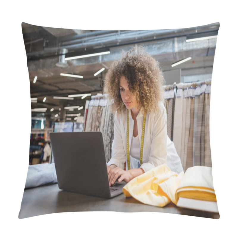 Personality  Curly Saleswoman With Measuring Tape Using Laptop Near Fabric Rolls In Textile Shop  Pillow Covers