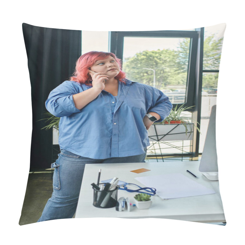 Personality  A Plus Size Woman With Pink Hair Talks On A Phone While Standing Near A Desk In A Modern Office Setting. Pillow Covers