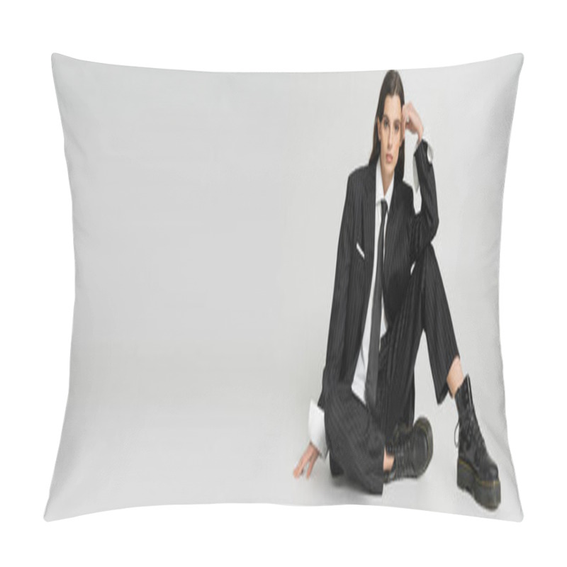 Personality  Stylish Woman In Elegant Formal Wear And Rough Laced-up Boots Holding Hand Near Head While Sitting On Grey Background, Banner Pillow Covers