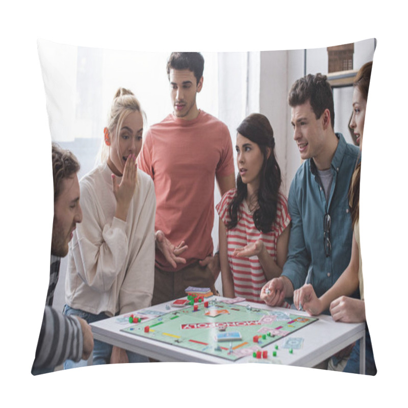 Personality  KYIV, UKRAINE - JANUARY 27, 2020: Shocked Girl Sitting Near Displeased Friends While Playing Monopoly Game Pillow Covers