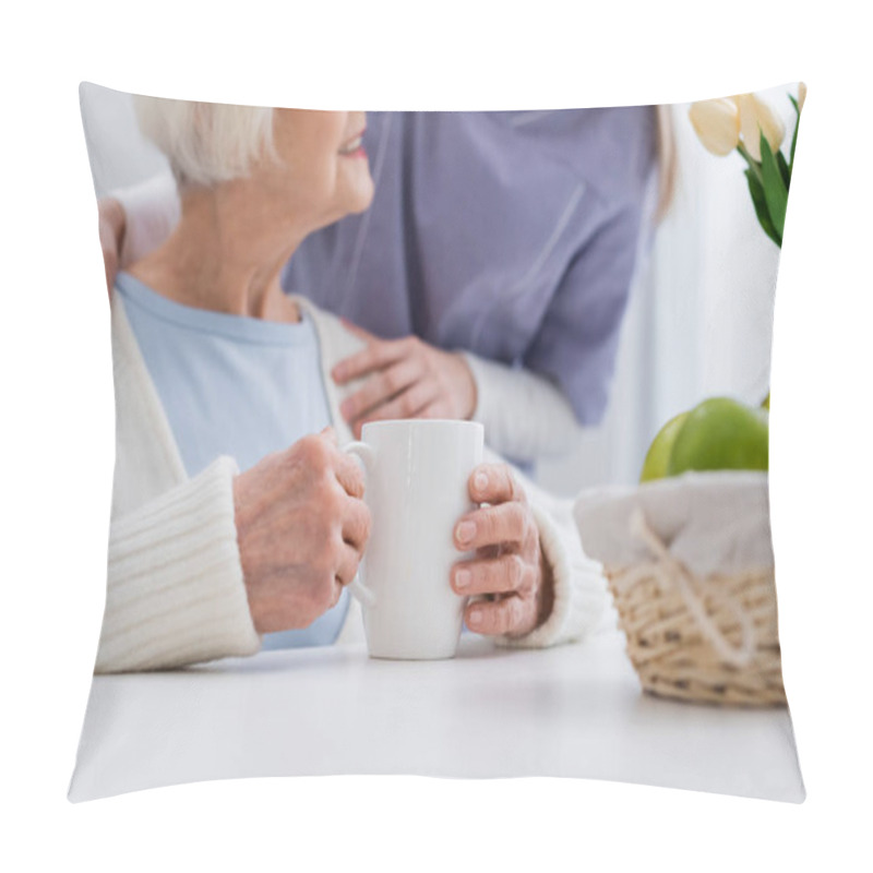 Personality  Cropped View Of Nurse Embracing Shoulder Of Smiling Senior Woman Near Cup Of Tea Pillow Covers