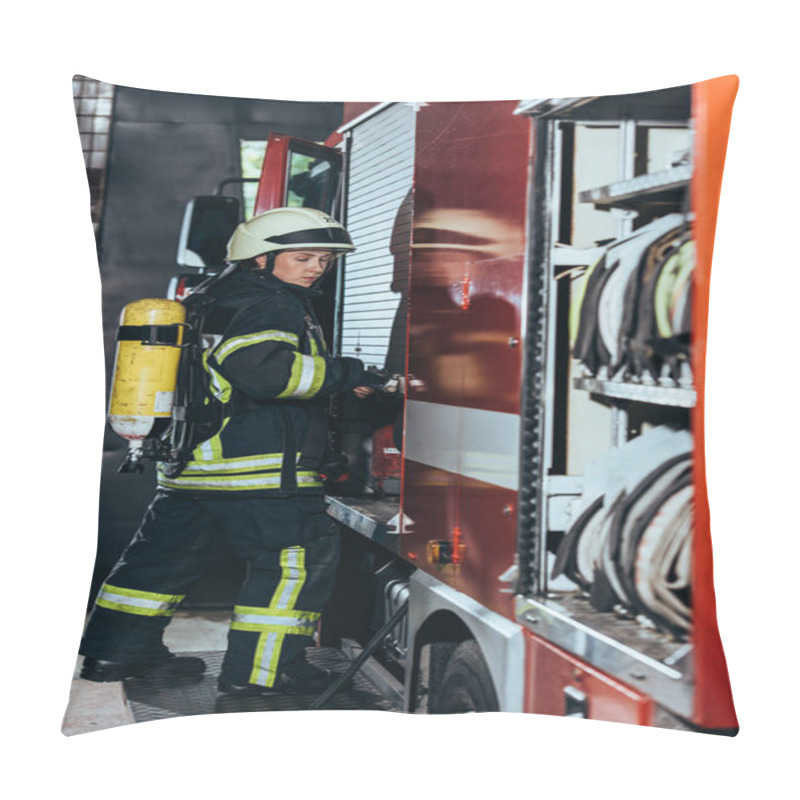 Personality  Side View Of Female Firefighter With Fire Extinguisher On Back Closing Truck At Fire Station Pillow Covers