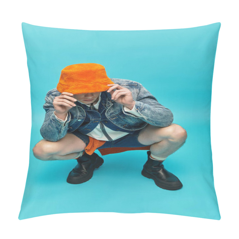 Personality  A Young Man With A Confident Expression Wears An Orange Hat And Denim Jacket While Squatting. Pillow Covers