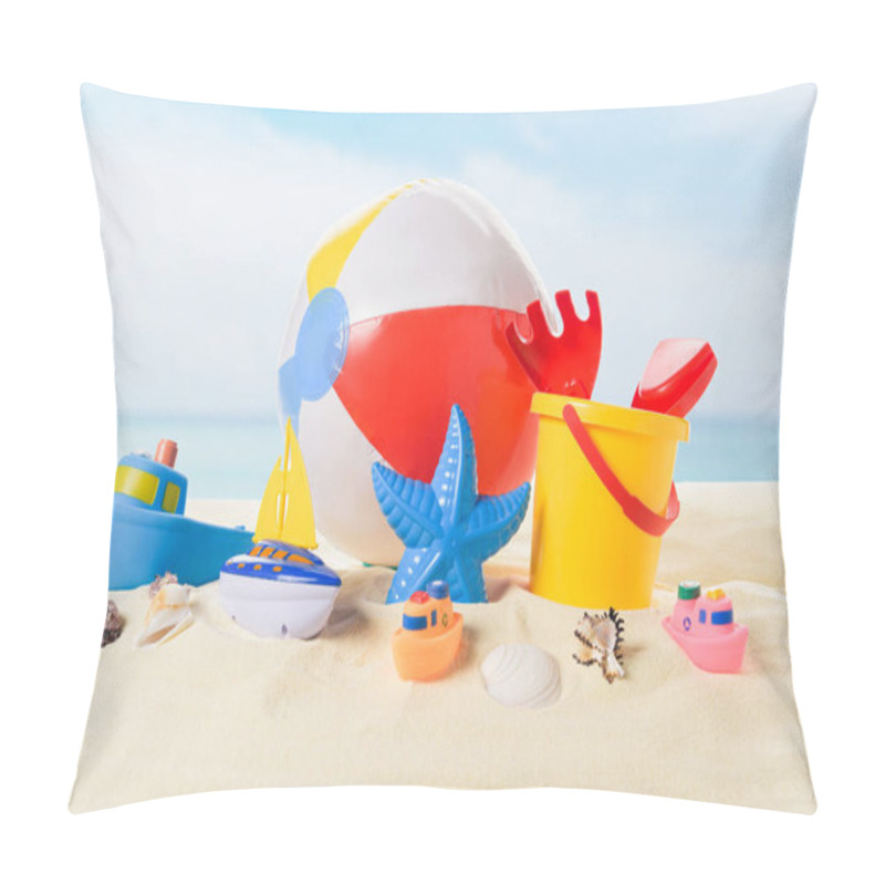 Personality  Beach Ball And Bucket With Toys In Sand On Blue Sky Background Pillow Covers