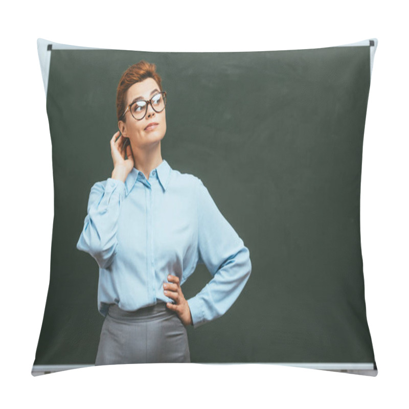 Personality  Thoughtful Teacher Touching Head And Looking Away While Standing With Hand On Hip Near Chalkboard  Pillow Covers