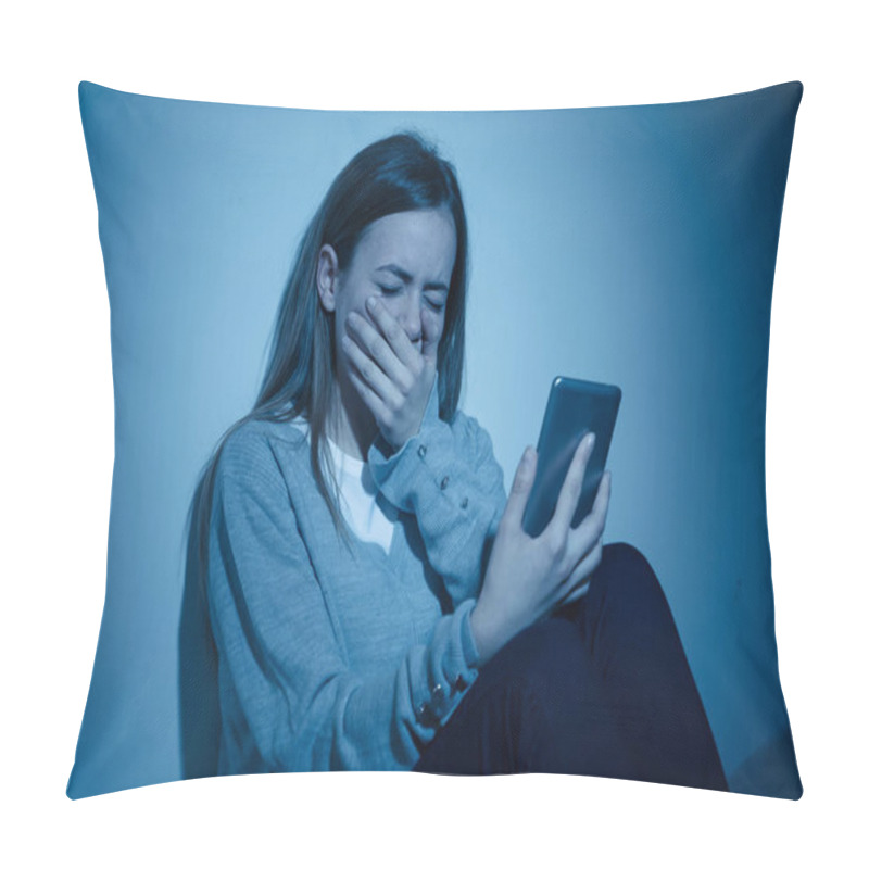 Personality  Sad desperate young teenager female girl on smart phone suffering from online bulling and harassment felling lonely and hopeless sitting on bed at night. CYberbullying and dangers of internet concept. pillow covers