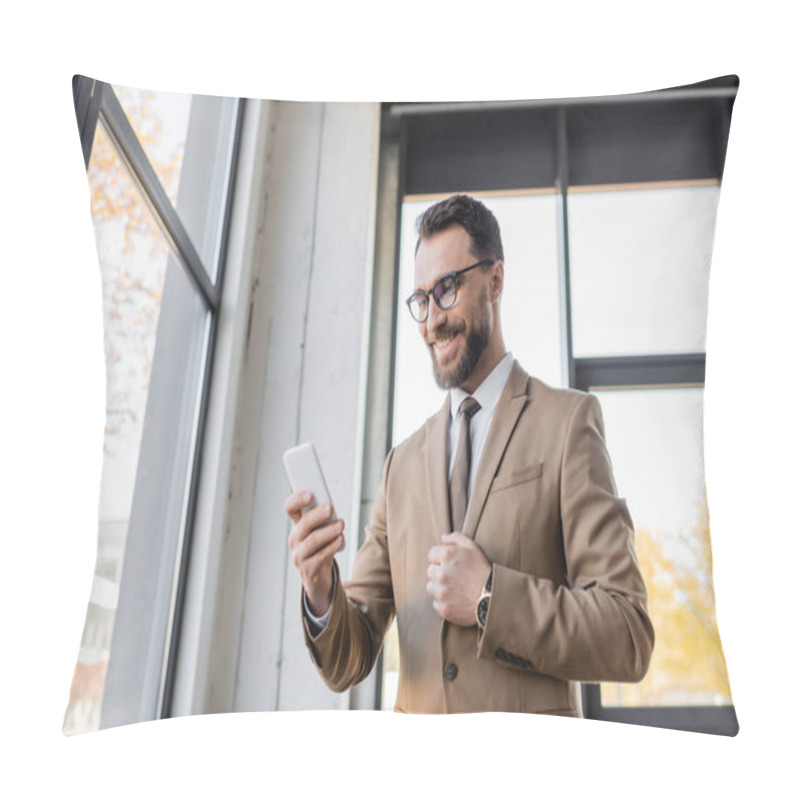 Personality  Charismatic And Cheerful Entrepreneur In Trendy Business Attire Such As Beige Blazer And Eyeglasses Standing Near Windows In Office And Looking At Mobile Phone Pillow Covers