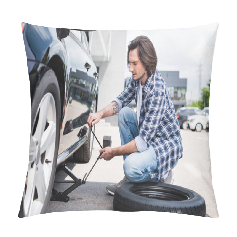 Personality  Man In Casual Wear Using Jack Tool And Changing Broken Wheel On Auto, Car Insurance Concept Pillow Covers