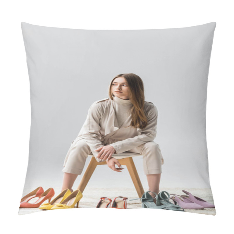 Personality  Elegant Girl Looking Away While Sitting Near Collection Of Shoes On Grey Background Pillow Covers