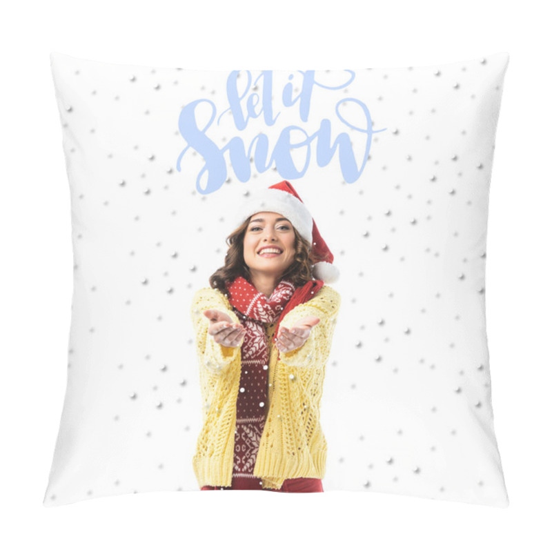 Personality  Joyful Young Woman In Santa Hat And Scarf Standing With Outstretched Hands Near Let It Snow Lettering On White Pillow Covers