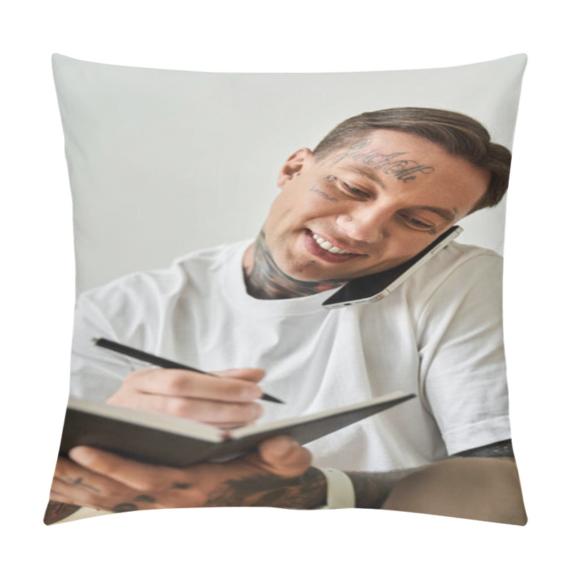 Personality  A Young Man Smiles As He Jots Down Ideas, Multitasking Between A Phone Call And Note Taking. Pillow Covers