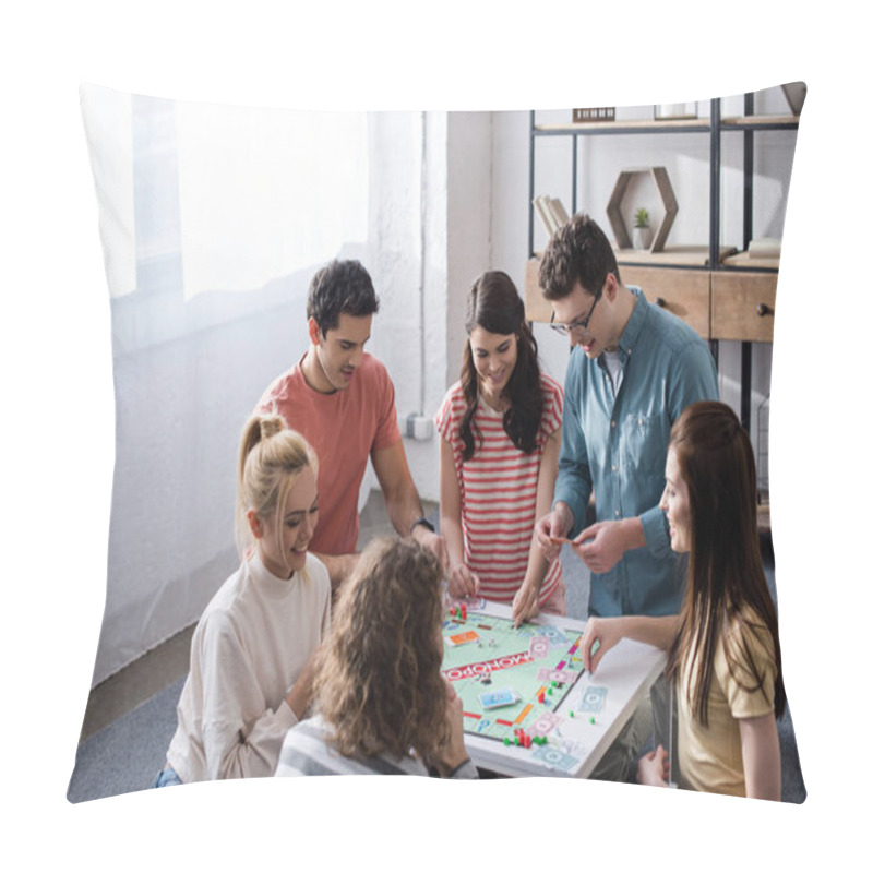 Personality  KYIV, UKRAINE - JANUARY 27, 2020: High Angle View Of Smiling Friends Playing Monopoly Game At Home Pillow Covers