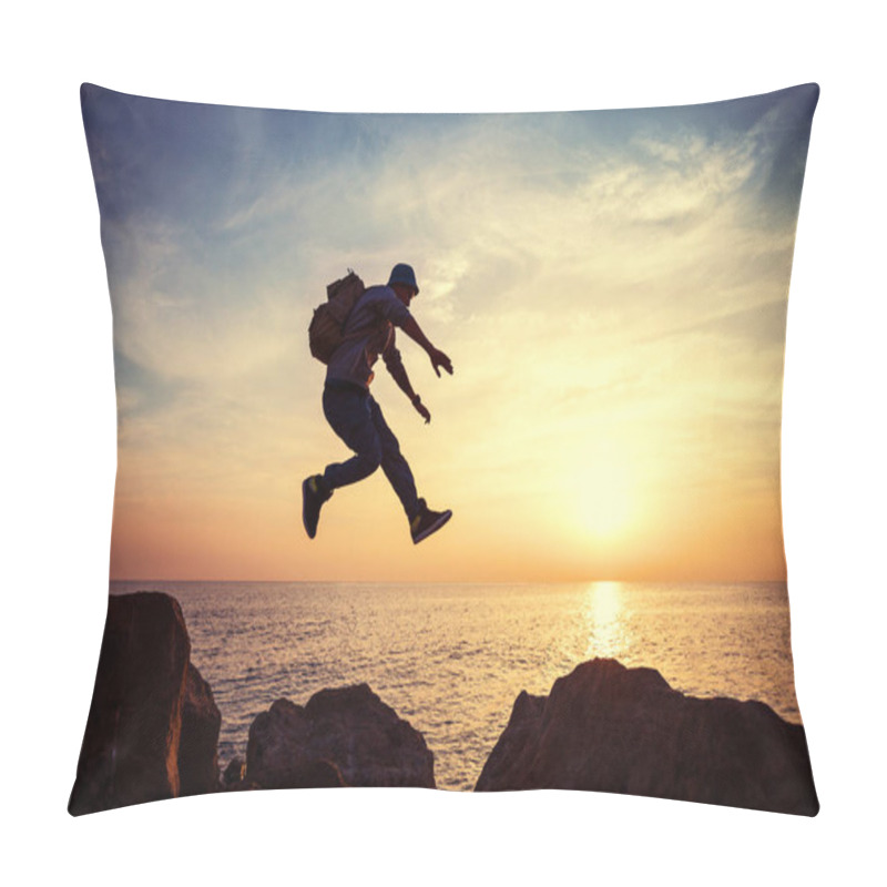 Personality  Brave Man With Backpack Jumping Over Rocks Near Ocean In Sunset Pillow Covers