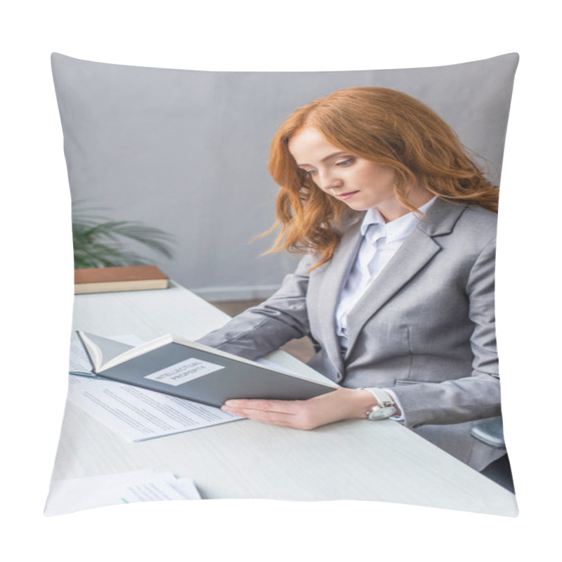 Personality  Redhead Lawyer Reading Book With Intellectual Property Lettering At Workplace With Documents On Blurred Background Pillow Covers