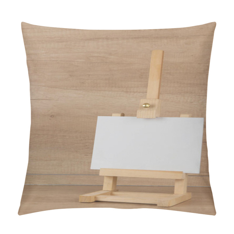 Personality  White Canvas On A Small Easel On A Light Wooden Background, Close Up, Blank Sheet Concept With Copy Space Pillow Covers