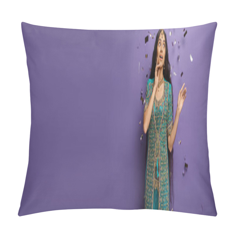 Personality  surprised young indian woman under confetti rain on purple backdrop with hand near face, banner pillow covers