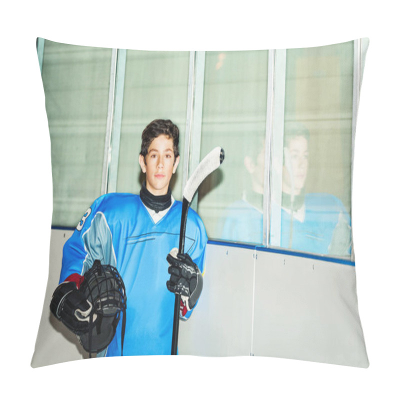 Personality  Portrait Of Teenage Boy, Professional Hockey Player In Blue Uniform, Standing On Ice Rink, Holding Helmet And Stick Pillow Covers