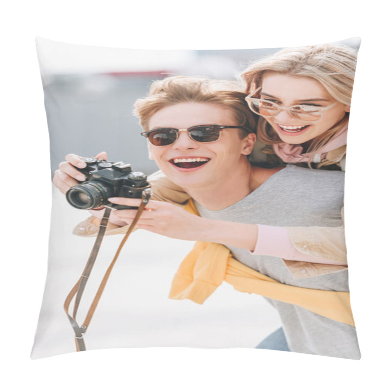 Personality  Smiling Tourist Giving Piggyback To Happy Girlfriend While She Taking Photo On Camera Pillow Covers