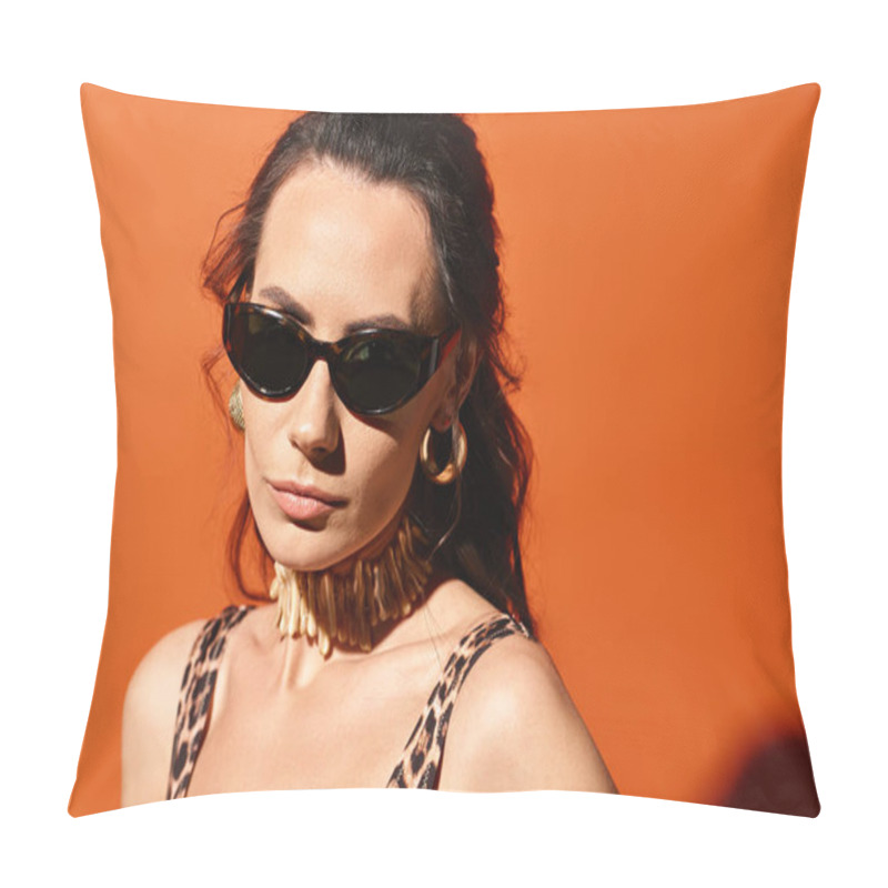 Personality  A Fashionable Woman Wearing Sunglasses And A Leopard Print Top Poses Confidently In A Studio Against An Orange Background. Pillow Covers