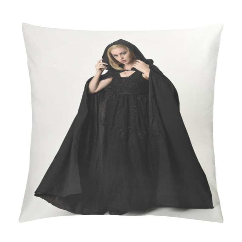 Personality  Full Length Portrait Of Blonde Girl Wearing Long Black Flowing Cloak, Standing Pose  With  A White Studio Background. Pillow Covers